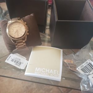 Michael Kors rose gold watch.